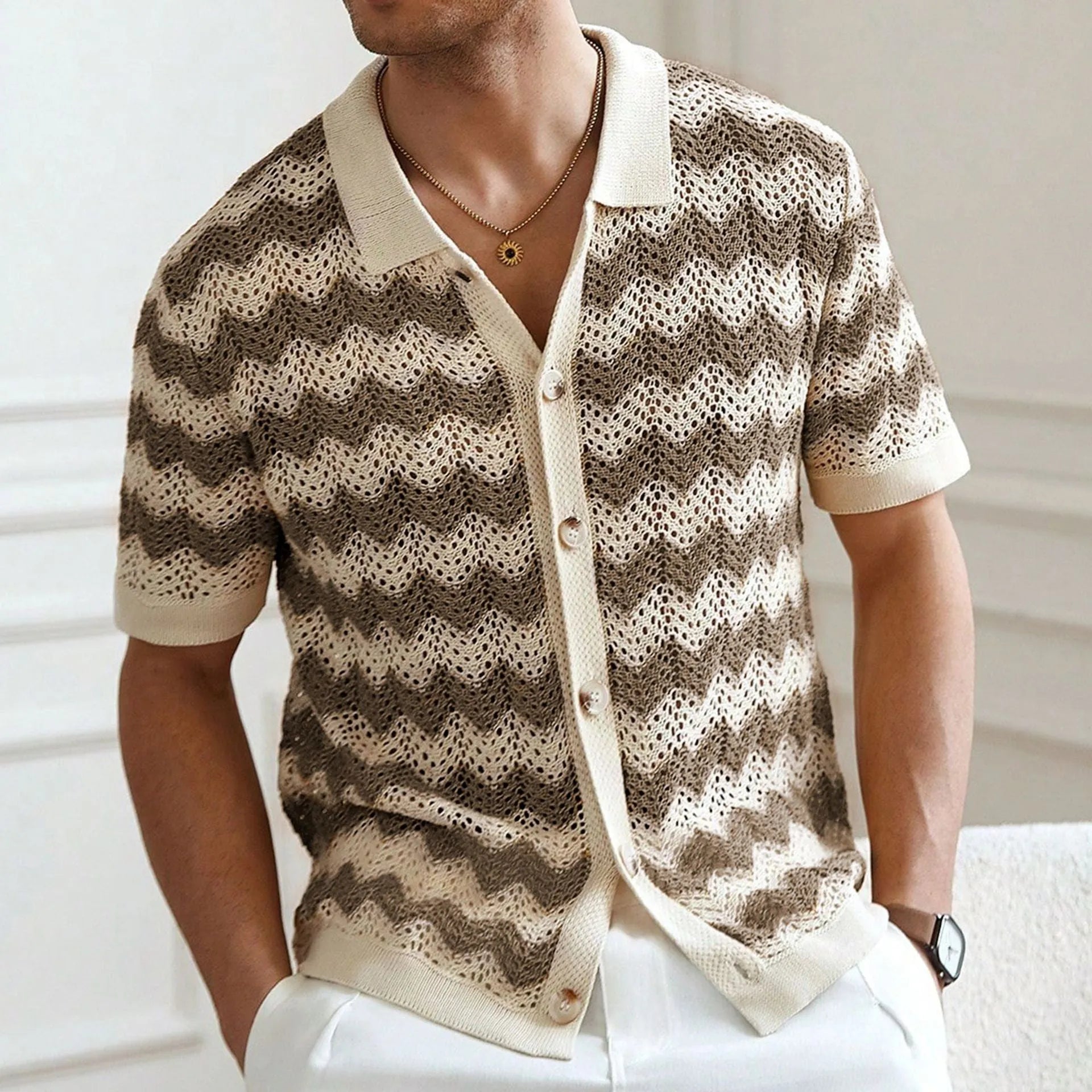 Short sleeve corrugated Tencel sweater with a blue hollow jacquard texture on a hanger.