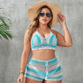 Blue women's plus size hollow out strap split swimsuit briefs on a white background.