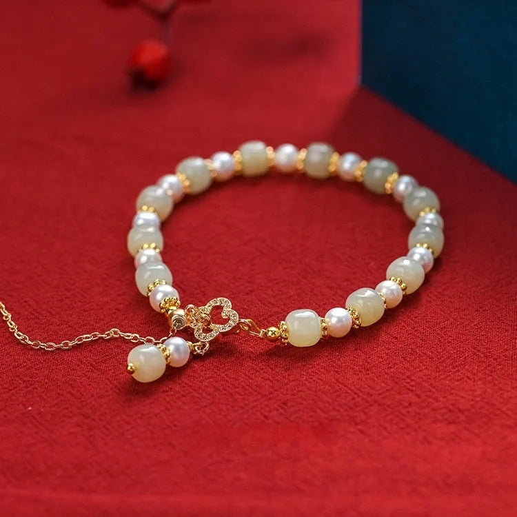 Women's Hetian jade bracelet with round pearl pendant and gold electroplated metal links