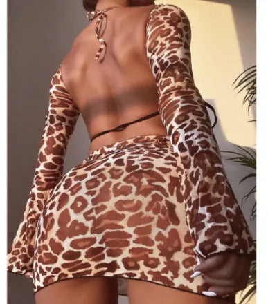 Leopard print women's bikini swimsuit set with halter top and high-waisted skirt bottom
