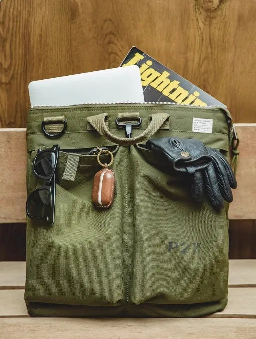 Marden Tooling Helmet medium canvas messenger bag in charcoal black showing vertical square shape and shoulder strap
