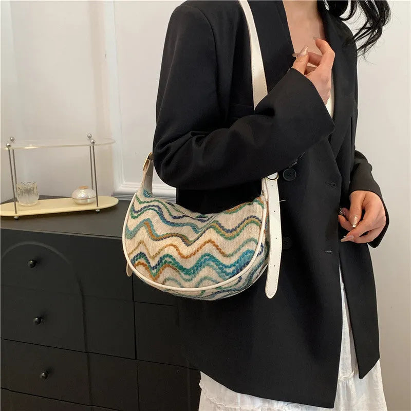 Women's straw woven crossbody bag with internal phone pocket and document compartment in corrugated brown