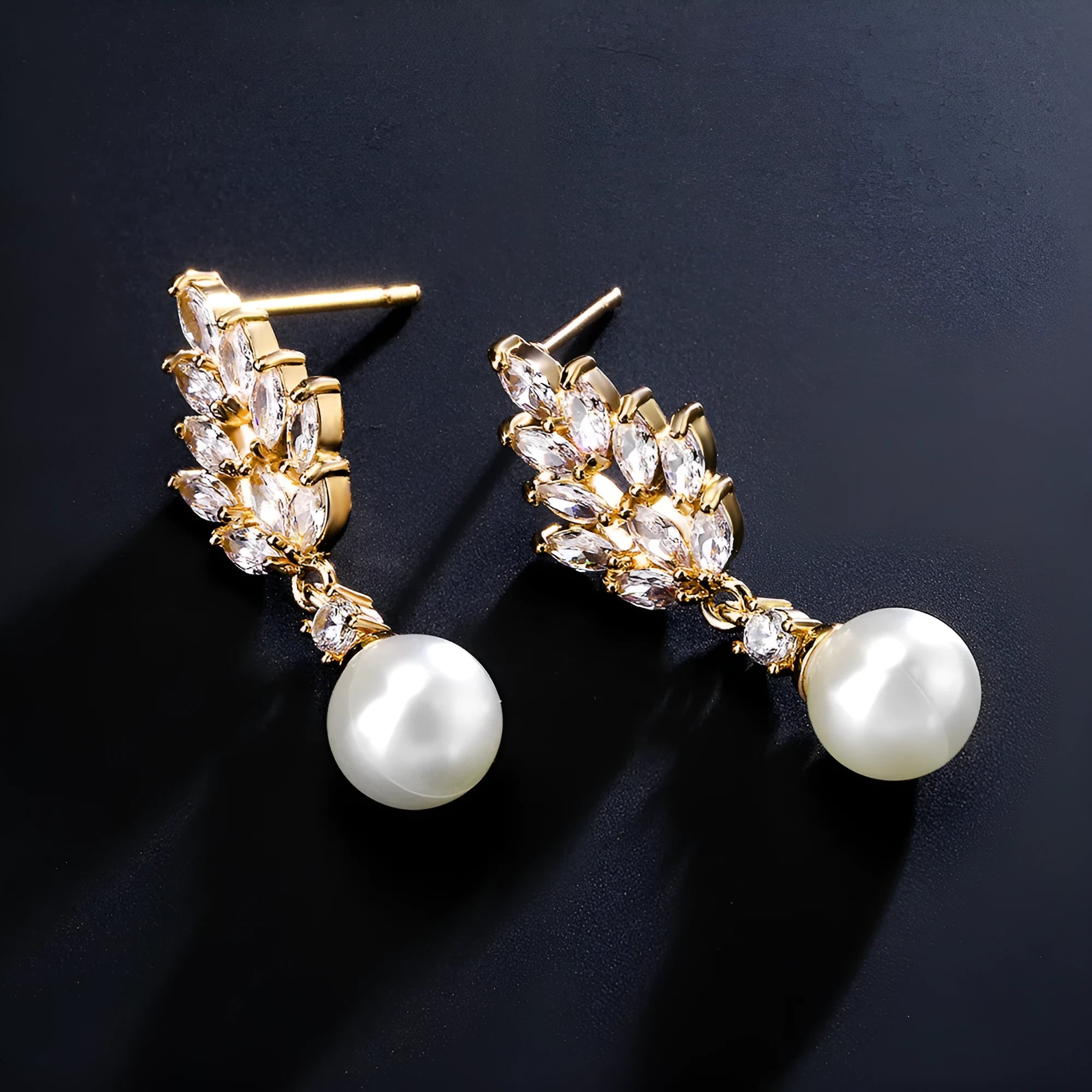 Geometric flower-shaped earrings with micro-inlaid zircon stones and pearl accents in gold, platinum, or rose gold plating.
