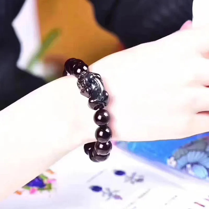 Natural eye obsidian bracelet with grey and black banding, showing multiple bead size options