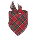 Plaid triangle dog bandana with tassels in autumn colours on a dog's neck.