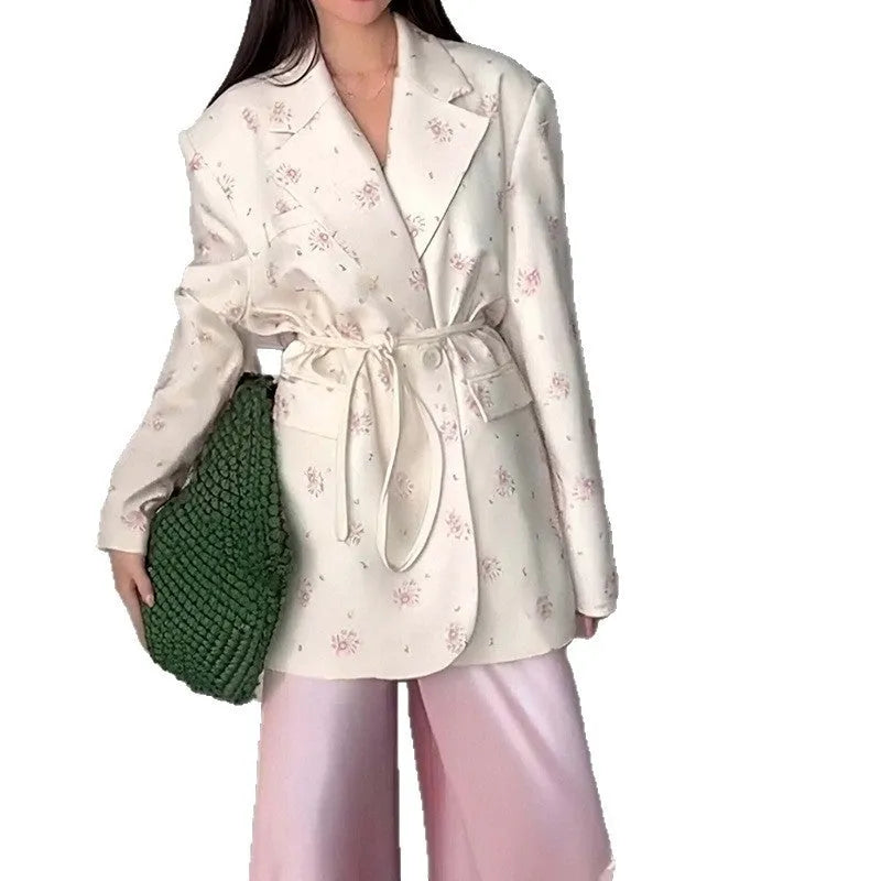 Printed collar suit jacket with lace-up front detail in apricot, shown on a hanger.