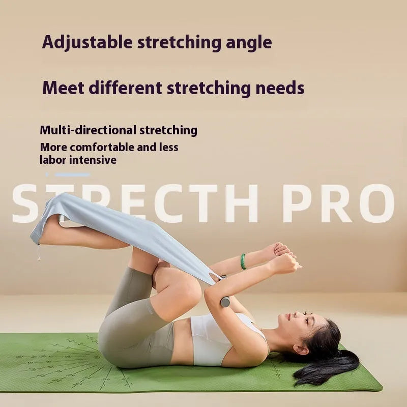 Grey and pink yoga stretching tool for shoulders, back, and hips on a fitness mat.