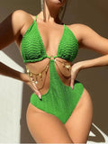 Women's black bikini swimsuit with chain detail on a mannequin.
