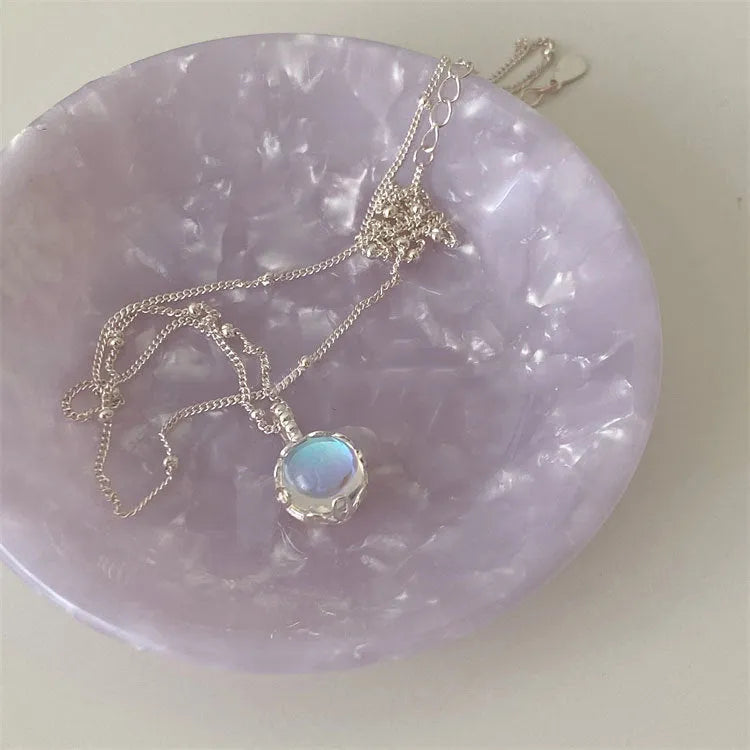 Silver 925 ornamental stone necklace with geometric pendant on a curb chain.