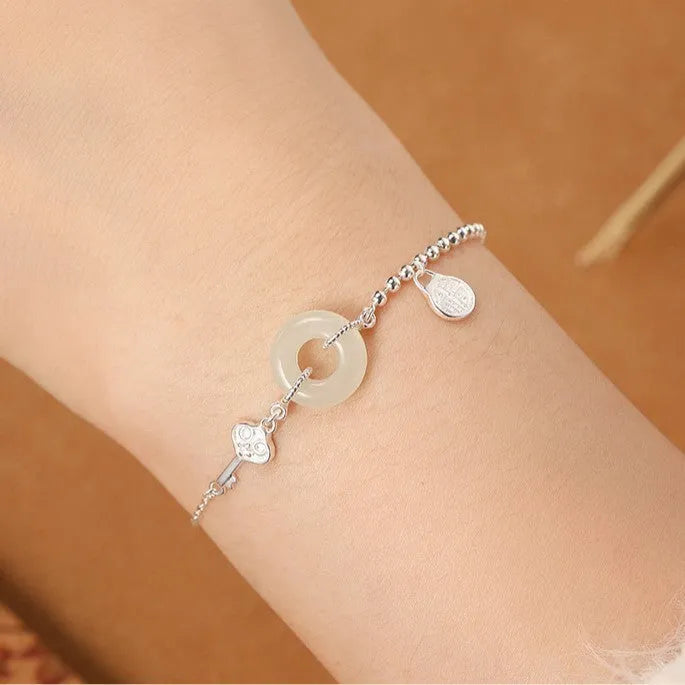 Hetian jade and 925 silver women's bracelet with geometric Chinese design and blessing card motif