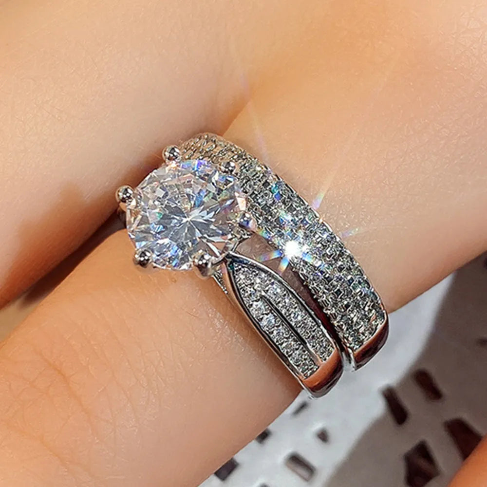 White gold geometric combined wedding ring and simple bracelet on size display.
