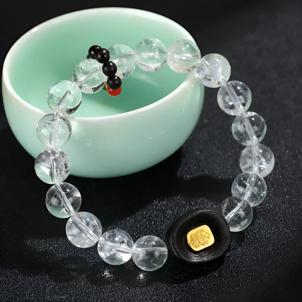 Handmade natural white crystal ebony bracelet with five warp design on wooden background