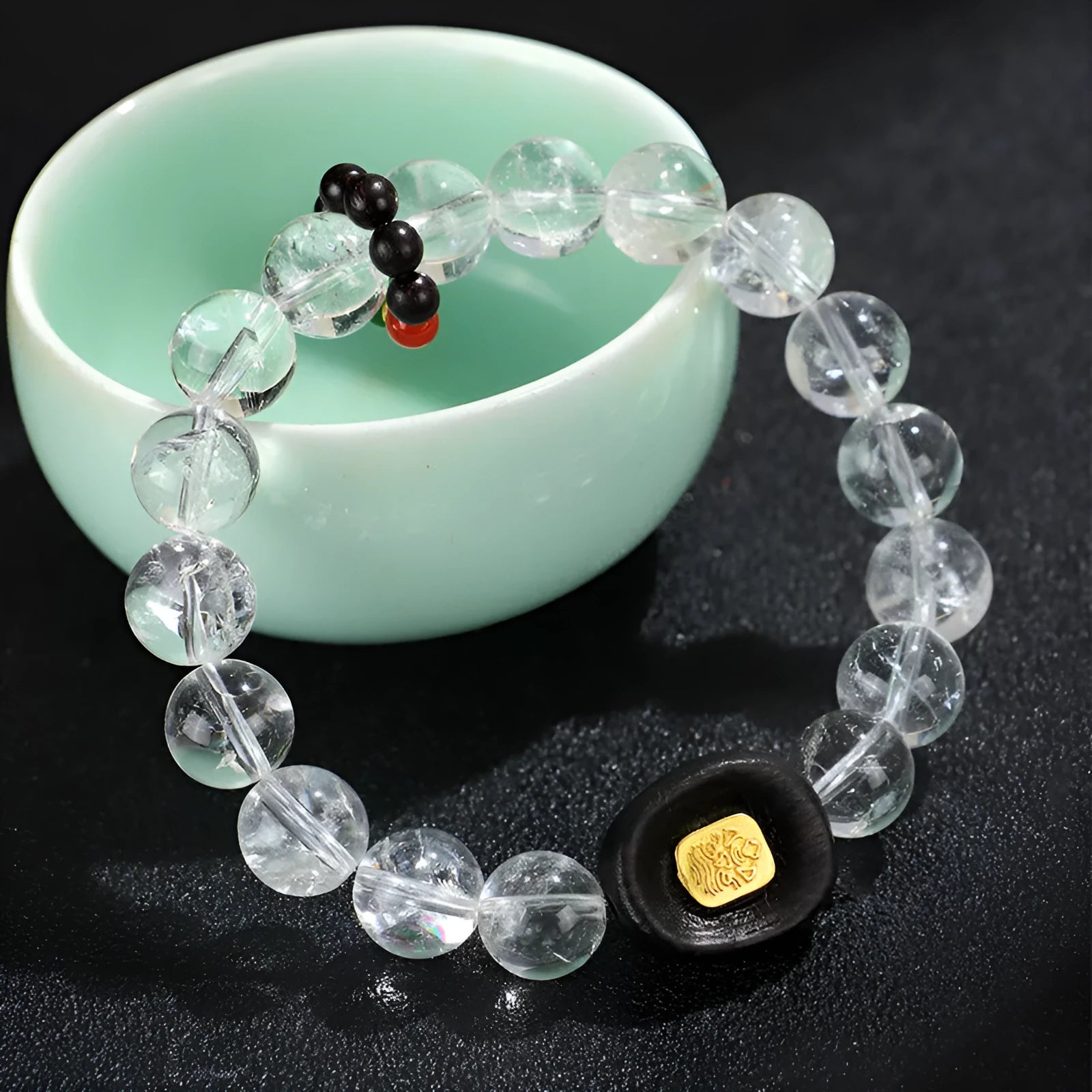 Handmade natural white crystal ebony bracelet with five warp design on wooden background