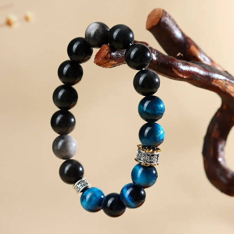 Handmade peacock blue Tigereye stone bracelet with geometric silver beads in ethnic style