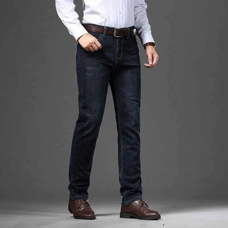 Straight leg stretch jeans in blue denim on a mid-waist model, showing zip fly and high elasticity fabric.