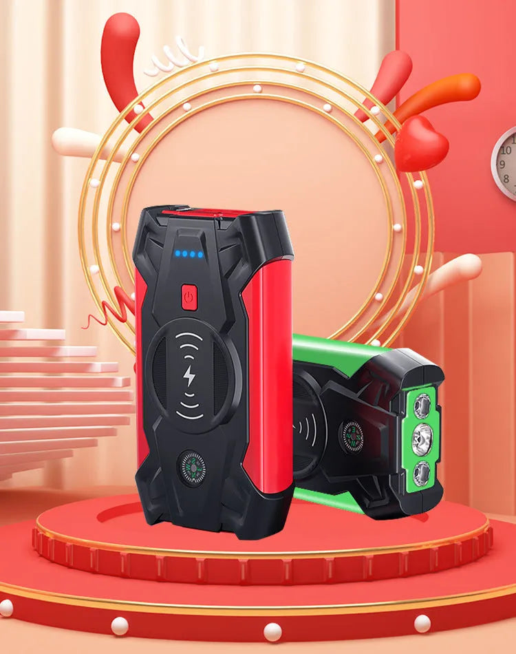 Red car emergency jump starter power pack with connection clips on a black background