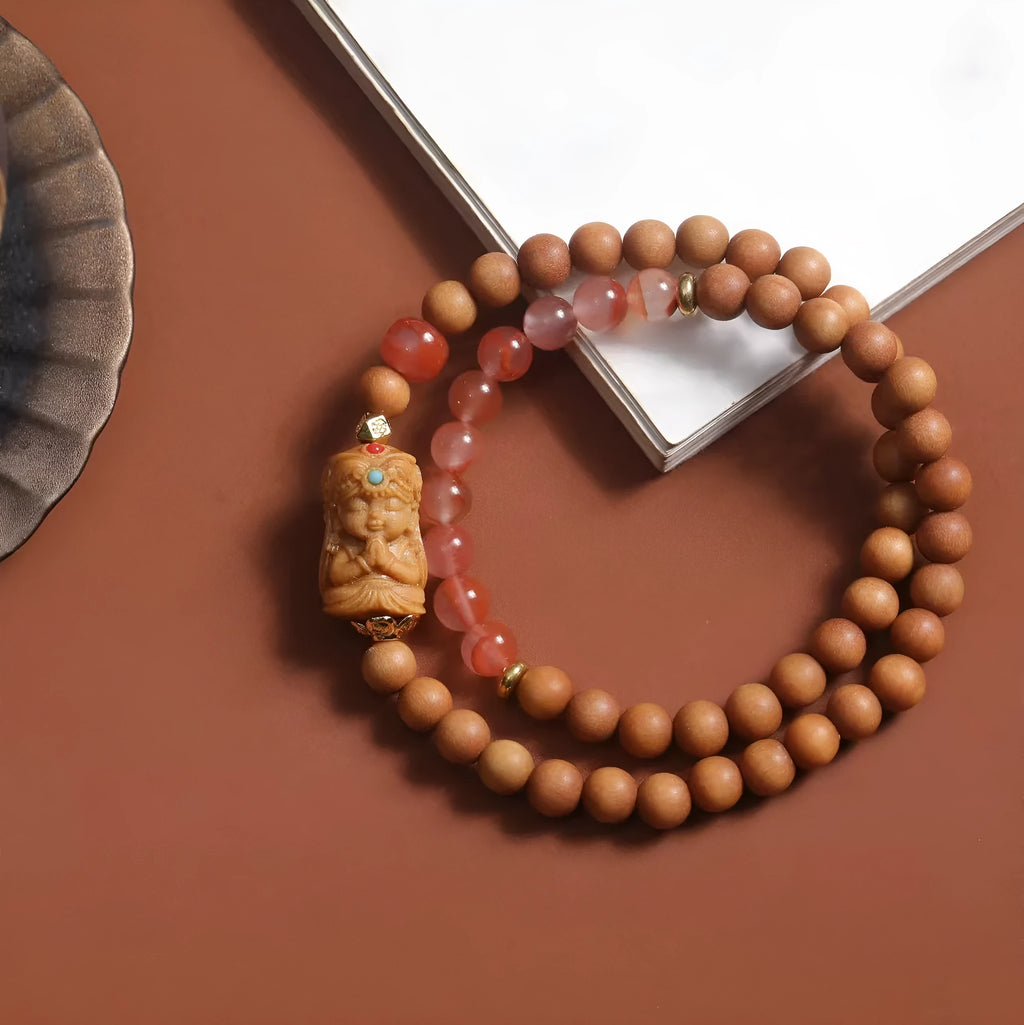 Brown sandalwood bracelet with woven South Red Zachilam design and 6mm round beads