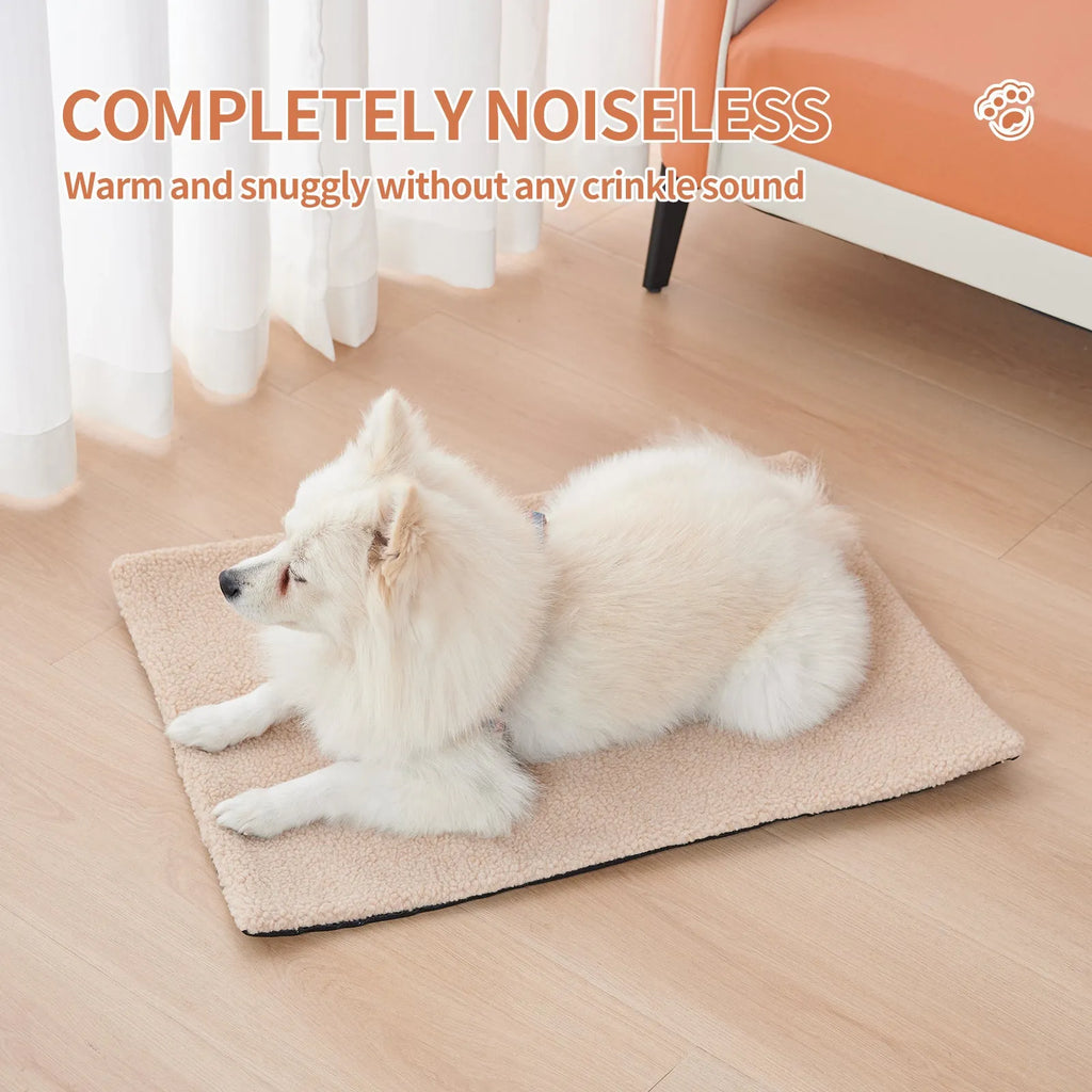 Grey self-heating plush pet pad for cats and dogs on a wooden floor.