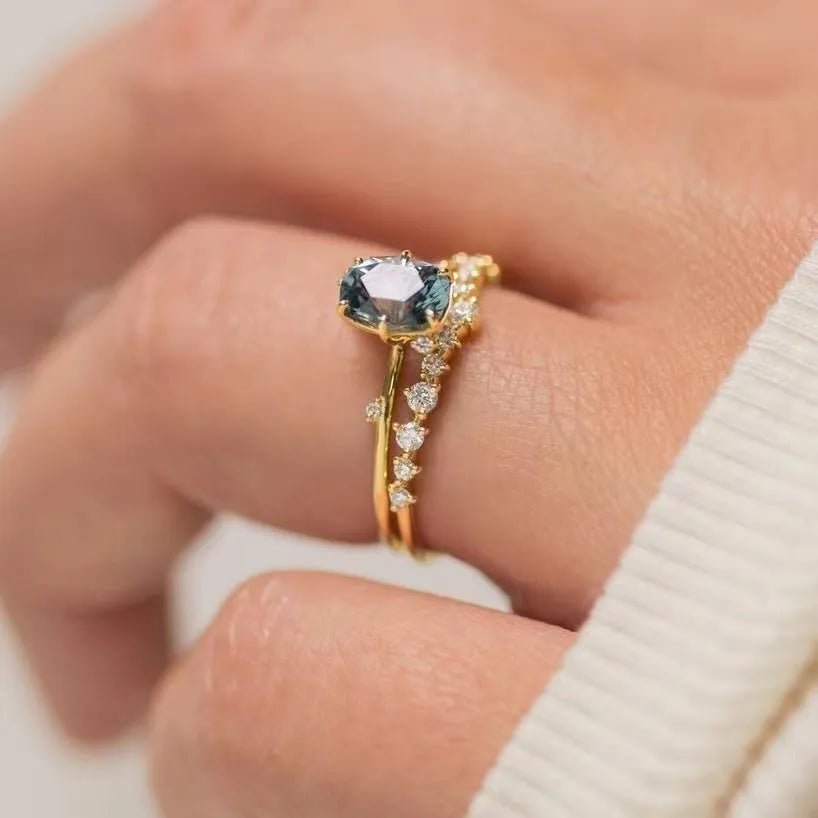 Gold-plated women's ring with green zircon centre stone in floral design showing couple set