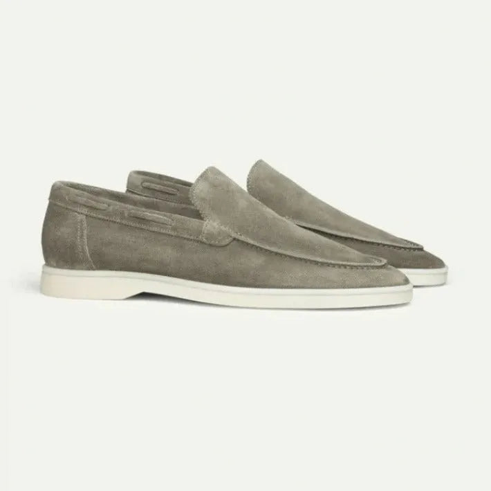 Men's matte suede flat shoes in sky blue with round toe and rubber sole on a plain background