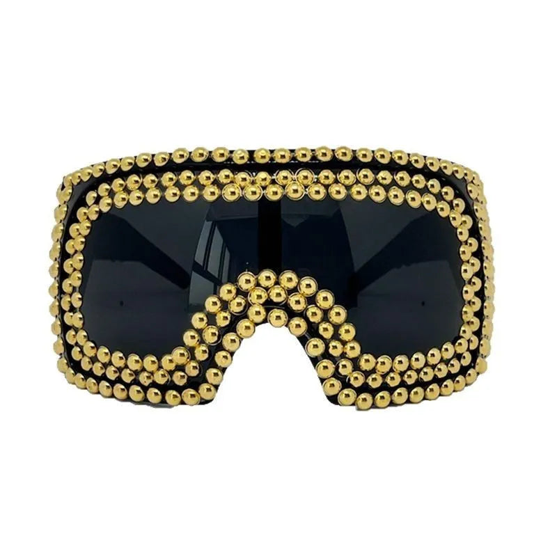 Men's punk-style sunglasses with large rim and square rivets in silver and gold colours