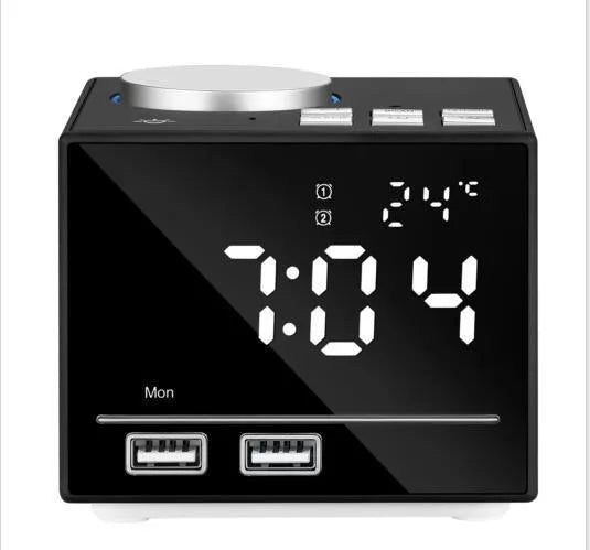 Bluetooth speaker alarm clock with colourful ambient light, LED mirror display, and dual USB ports on a nightstand