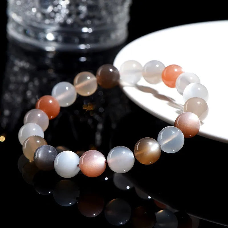 Natural colourful moonstone bracelet with a single 8mm bead on a cord.