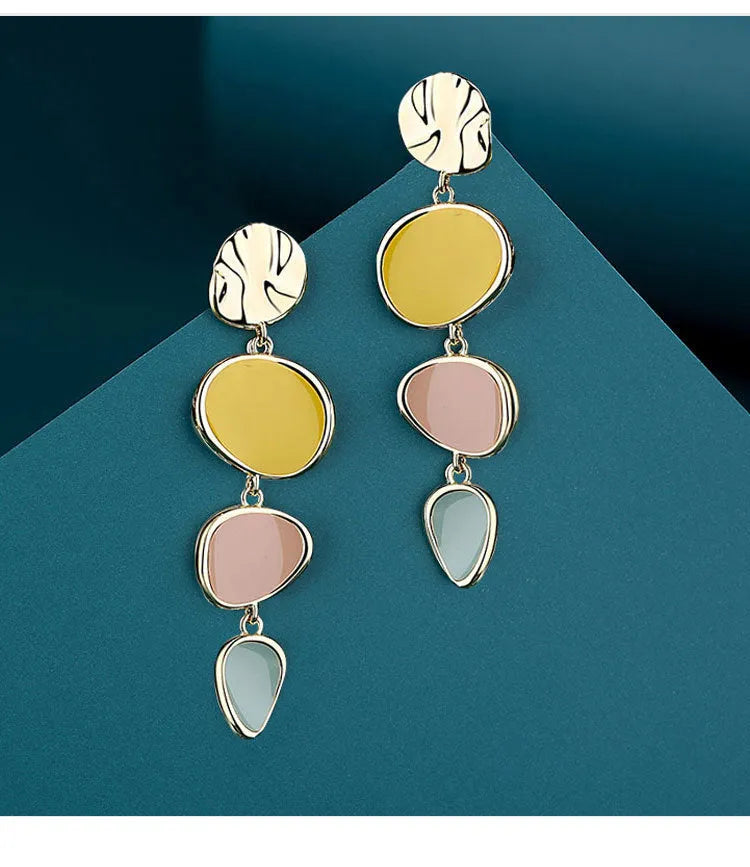 Sterling silver finish Morandi three-colour drip oil wafer disc earrings.