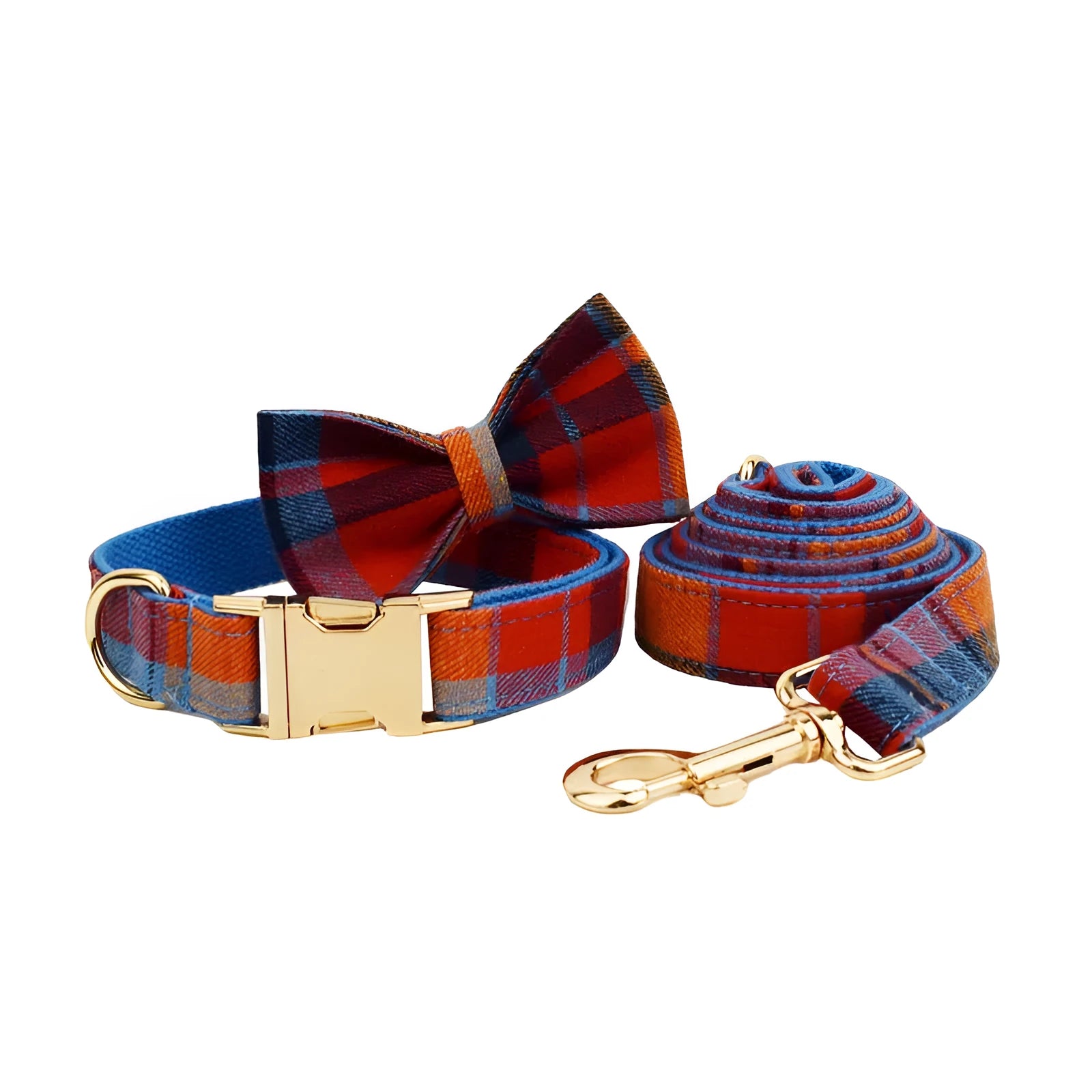 Blue background velvet plaid dog collar and matching hand holding leash on a white surface.