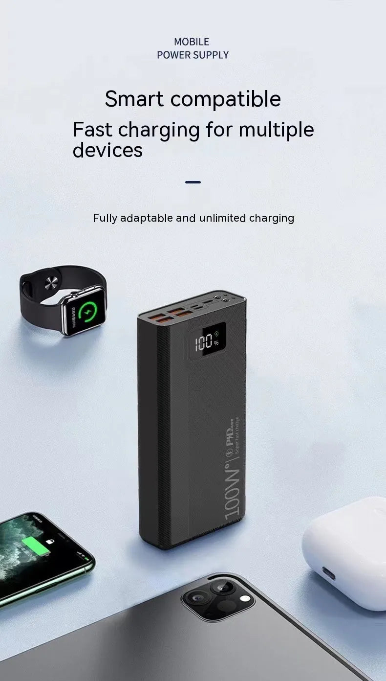Black and white large capacity portable power bank with fast charging, showing size scale.