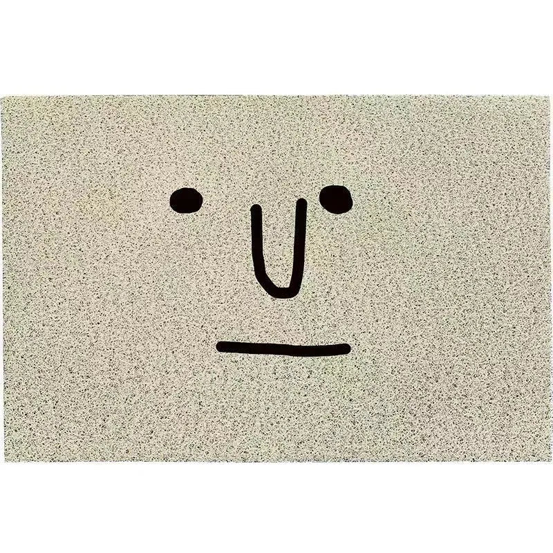 Square cartoon facial expression PVC floor mat in Mr. Big Nose colour and geometric pattern.