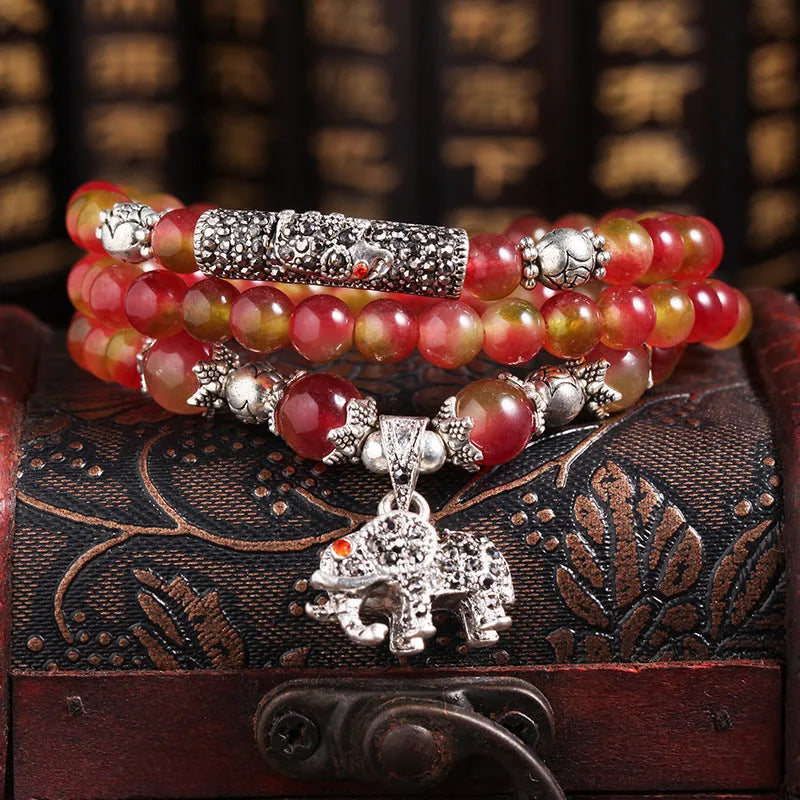 Handmade watermelon crystal bracelet with Chinese knot and geometric beads in 6mm or 8mm sizes.