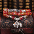Handmade watermelon crystal bracelet with Chinese knot and geometric beads in 6mm or 8mm sizes.