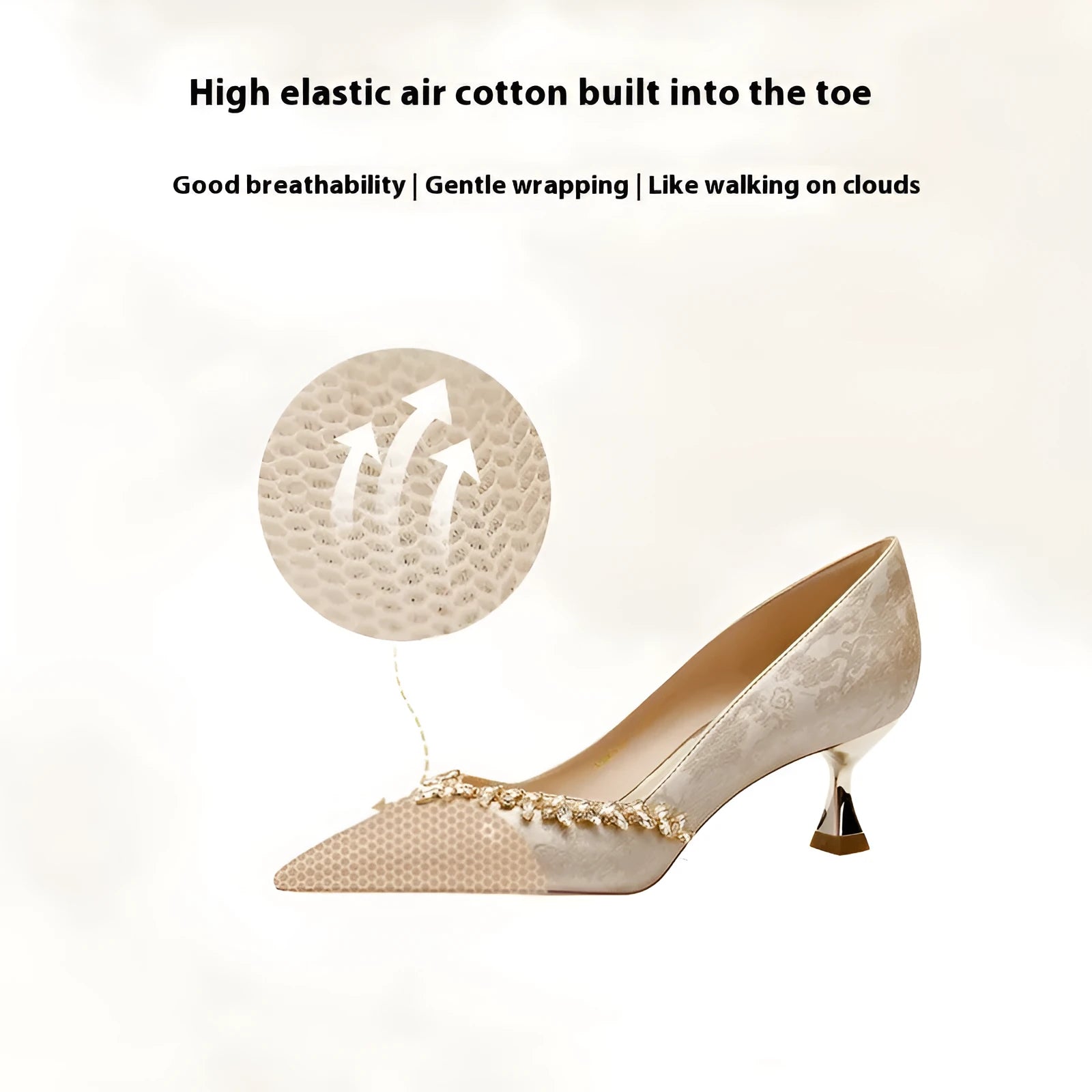 Women's champagne satin high heel wedding shoes with rhinestone decoration on a white background.