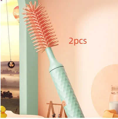 Pink electric bottle brush with rotating silicone head for cleaning baby bottles and pacifiers