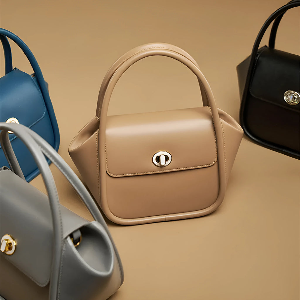 Women's cow leather wing tote bag with shoulder strap and latch closure in four colour options