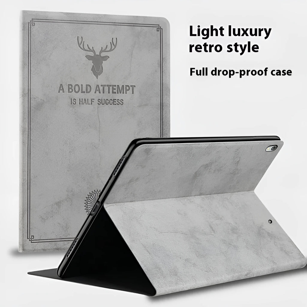 Creative deer pattern soft shell TPU leather clamshell case for iPad on a table.