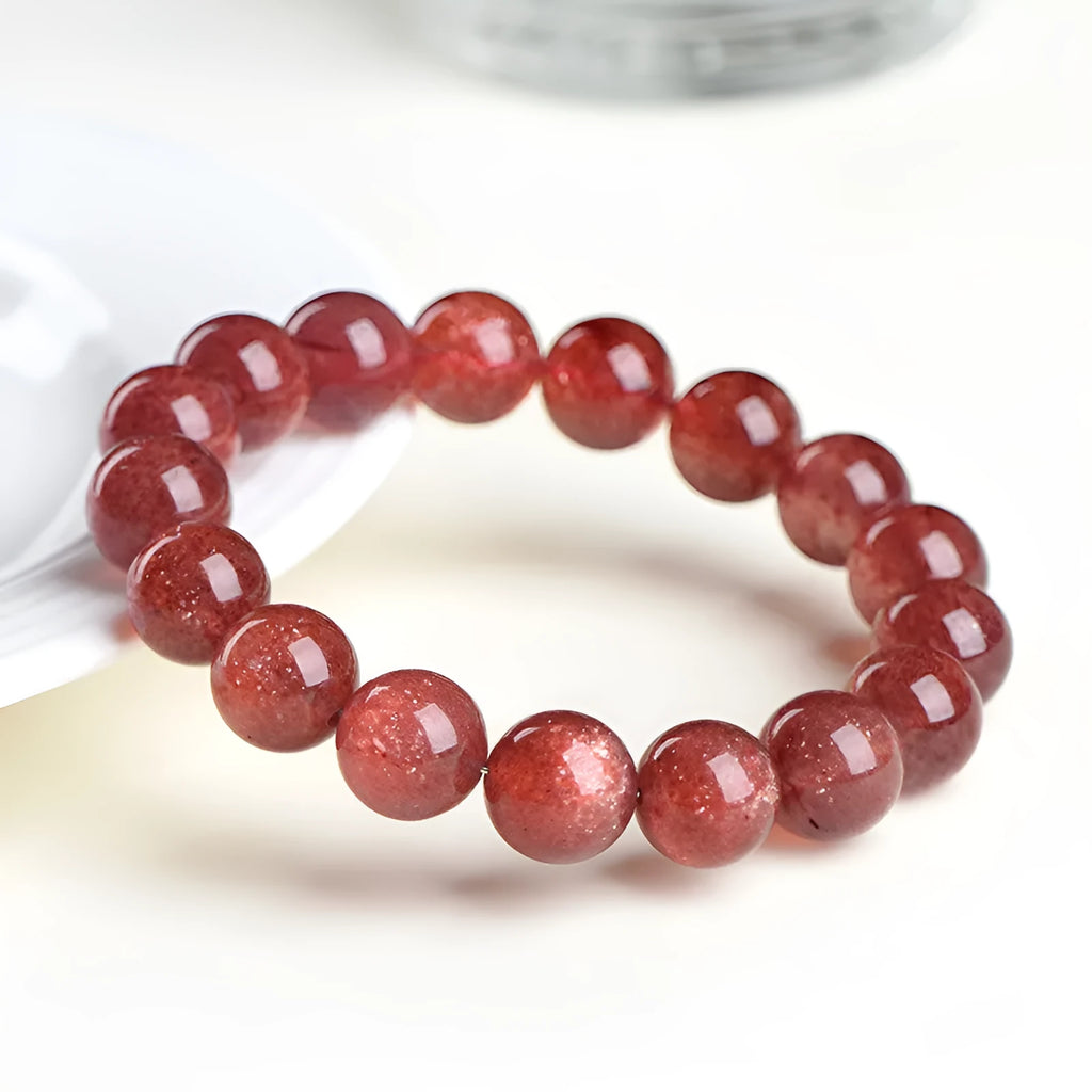 Natural cherry red strawberry quartz bracelet with polished geometry beads and starlight effect