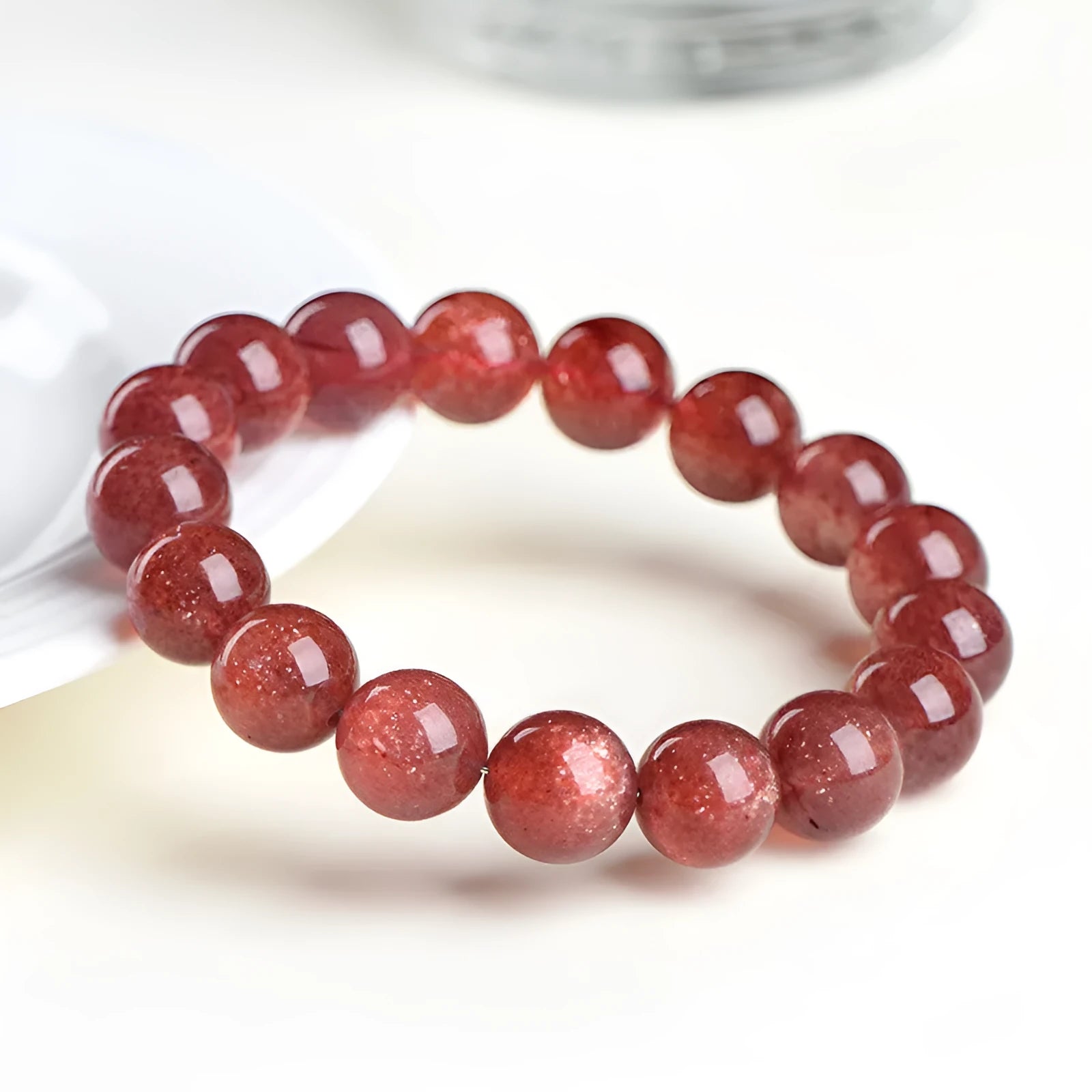 Natural cherry red strawberry quartz bracelet with polished geometry beads and starlight effect