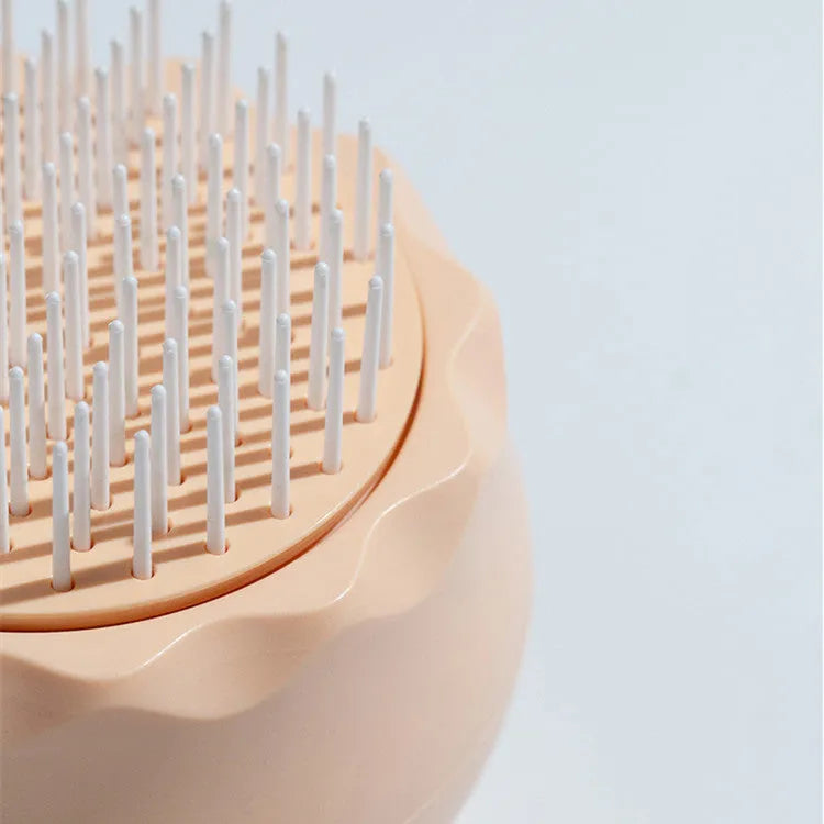 Floating massage pet needle comb in orange pink and baby blue, soft silicone brush for cat hair cleaning