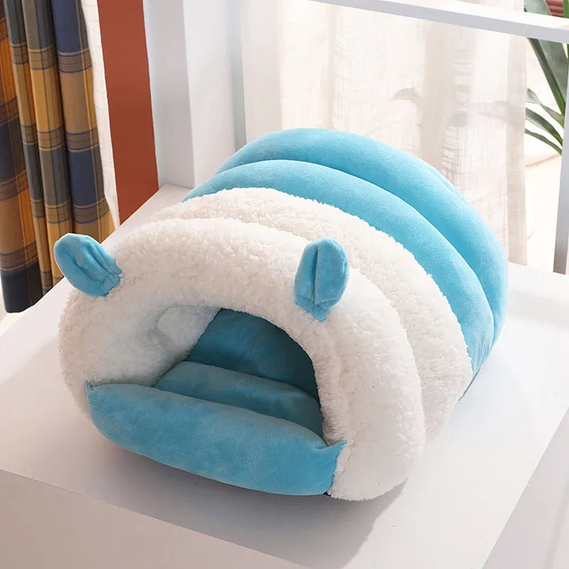 Blue enclosed cat nest with a soft fleece interior and a removable cushion, shown next to a ruler indicating its 40cm by 50cm size.