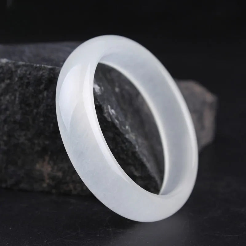 Gao bing jade bracelet in ice-white with flat rod and round rod style options on a wrist