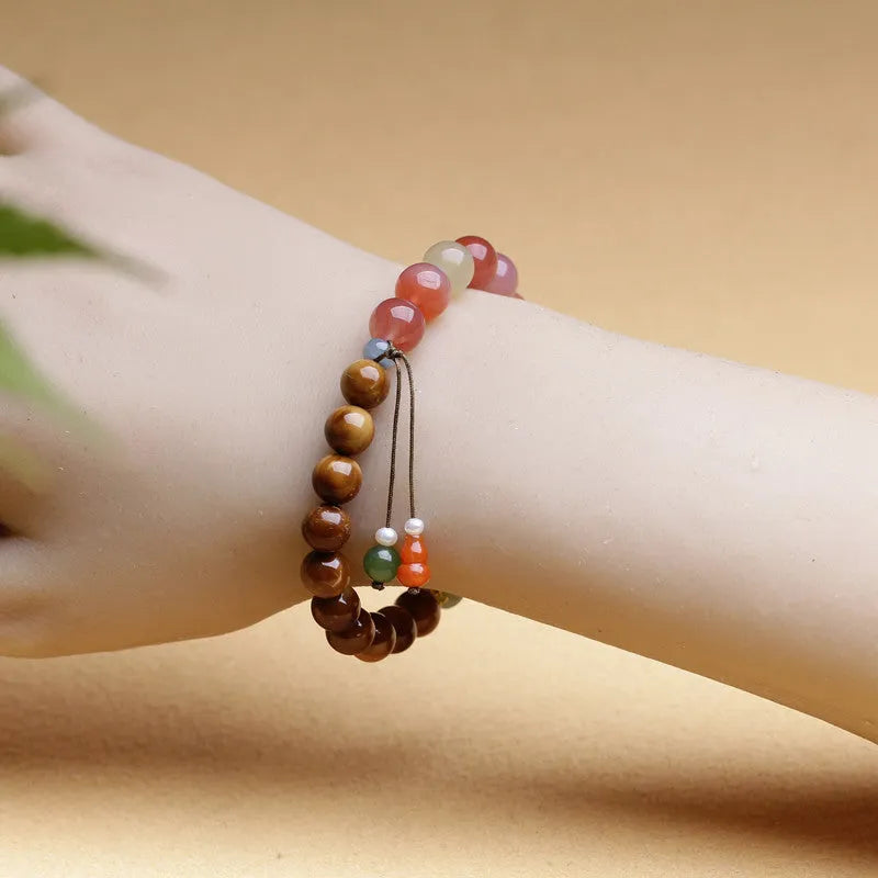 8mm diamond-shaped agate bracelet with natural persimmon colouration on woman's wrist
