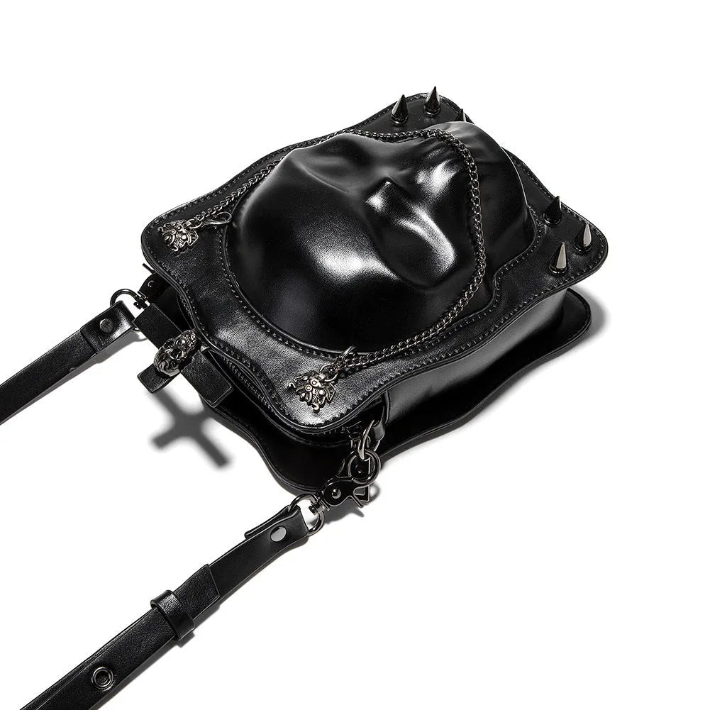 Black mini square shoulder bag with gothic skull design, embossed stitching detail, and chain crossbody strap