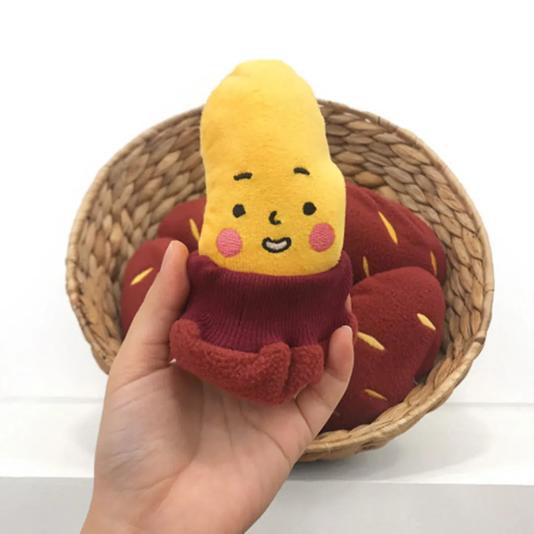 Red sweet potato dog puzzle toy with removable peel showing internal treat pockets