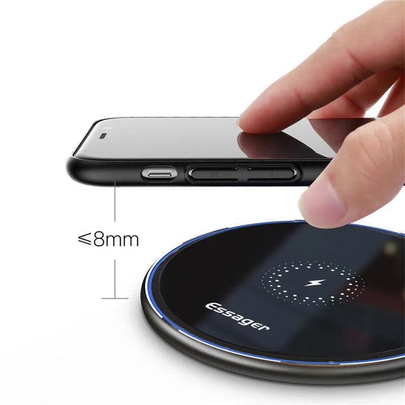 Black aluminium wireless charging pad with LED light and phone positioned for Qi charging