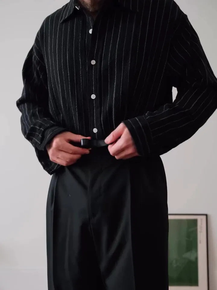 Black pinstriped button-down polyester shirt with regular fit on hanger
