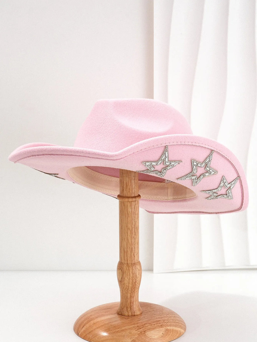 A beige woven polyester Western-style top hat with a conical crown and a hexagonal star detail on the front.