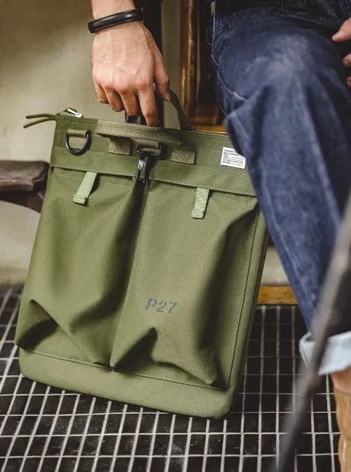 Marden Tooling Helmet medium canvas messenger bag in charcoal black showing vertical square shape and shoulder strap