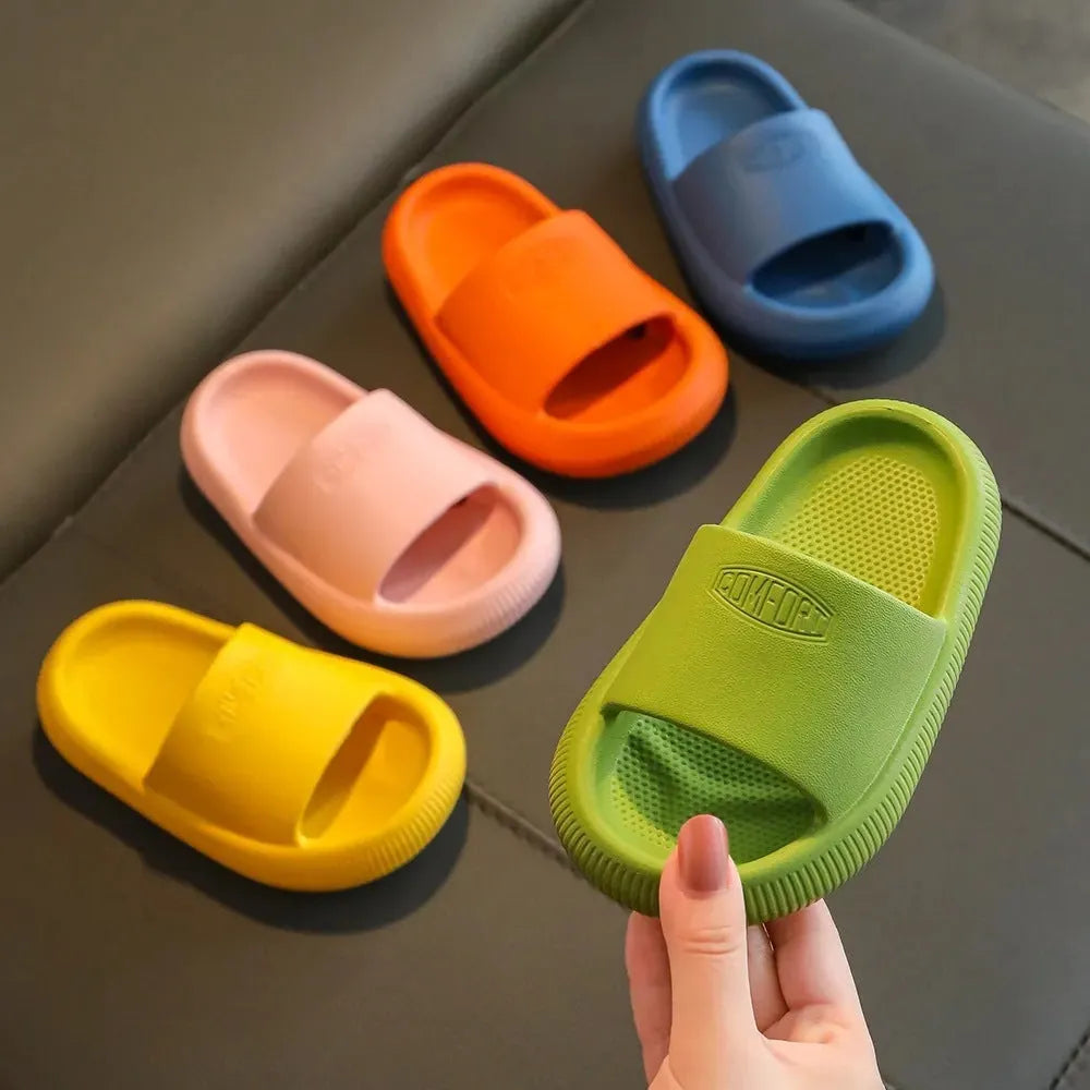Mixed colour children's EVA slippers with a non-slip, wear-resistant sole, shown in multiple size options.